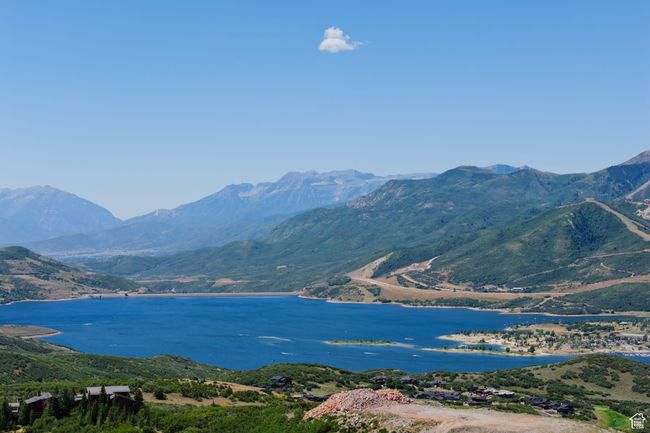 View of mountain background with a large body of water | Image 15
