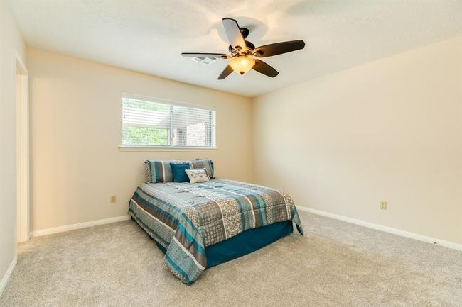 Primary suite offers spacious quarters with a large walk-in closet. New carpet in the bedroom. | Image 20