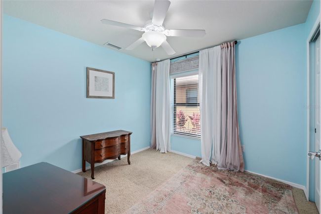 Third bedroom offers flexibility—perfect for guests, a home office, or hobby space. | Image 15
