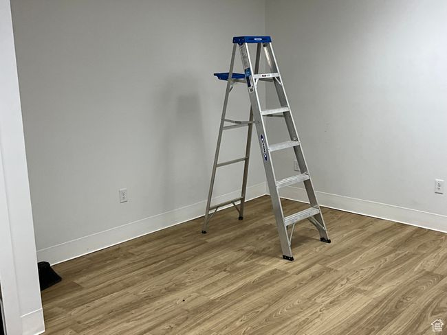 Spare room with baseboards and wood finished floors | Image 26