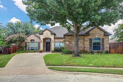 French country style house featuring a front lawn | Image 1