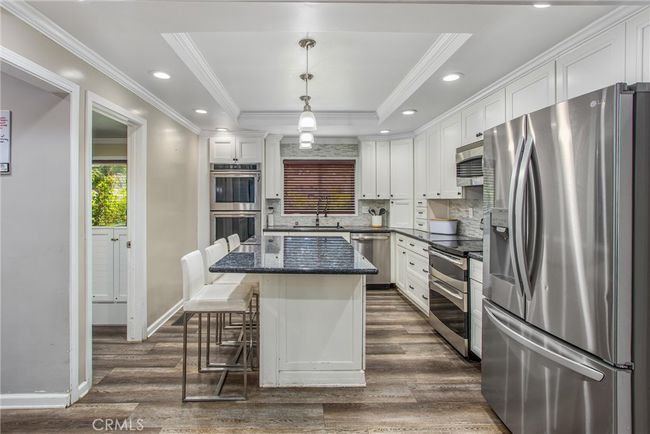 View of the kitchen, and to the right of the picture is a peek at the office. | Image 12