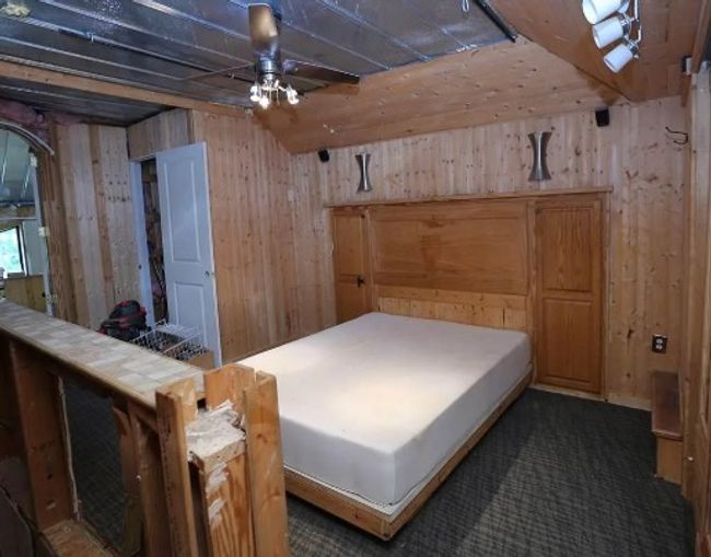 Bedroom featuring wood walls | Image 9