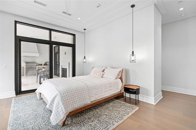 [Primary Bedroom] Italian hardwood flooring, custom pendant lighting and lots of natural light infuse this tranquil space... with private terrace access | Image 20