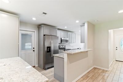 updated kitchen with granite counters and soft close cabinets | Image 2