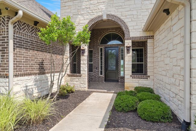 Nicely landscaped front area of home | Image 4