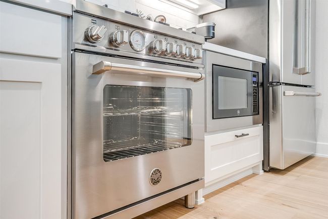 Interior details with baseboards, light wood-style floors, and stainless steel appliances | Image 10