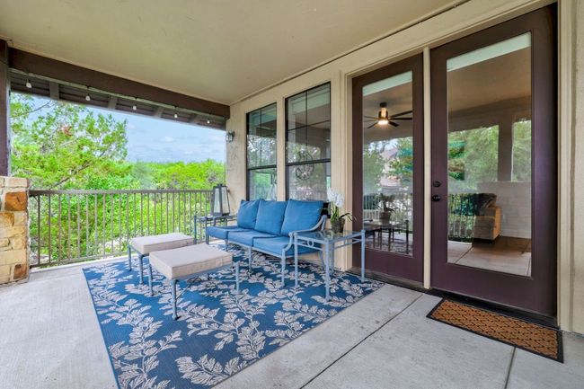 View of patio with an outdoor hangout area | Image 24