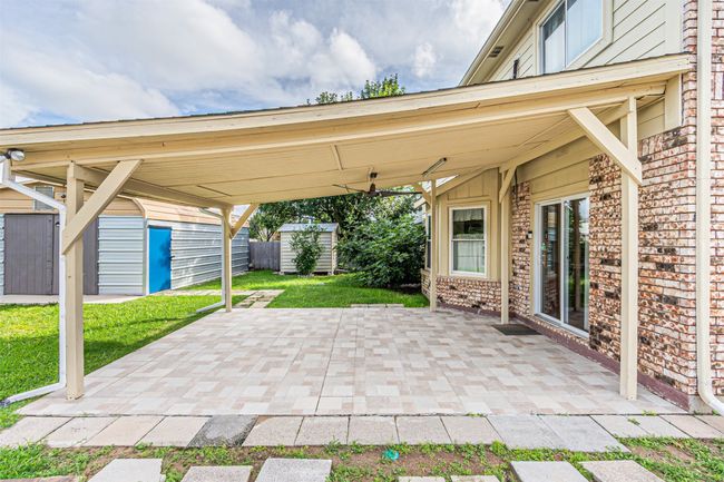 View of patio featuring a shed | Image 33
