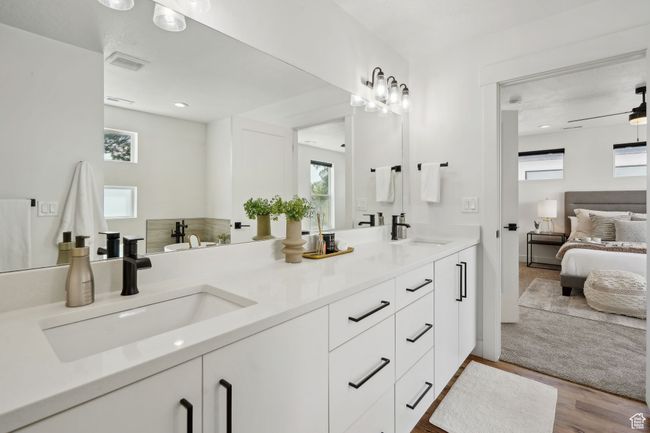 Bathroom with a sink, visible vents, and plenty of natural light | Image 18