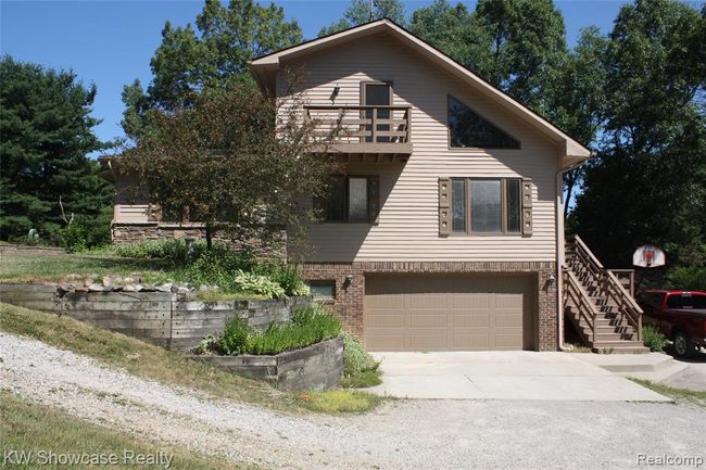 883 Manderly Drive- 2 car garage, and balcony from the loft area. | Image 54