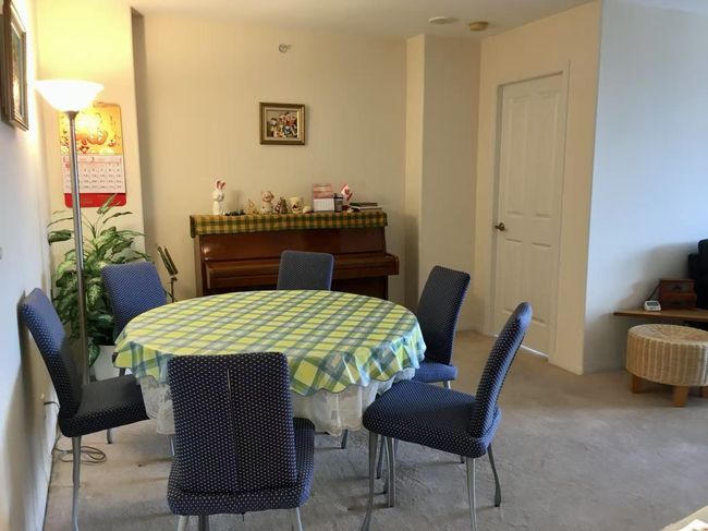 View of carpeted dining room | Image 8