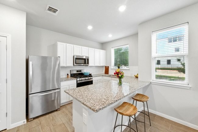 Granite countertops and stylish backsplash | Image 10