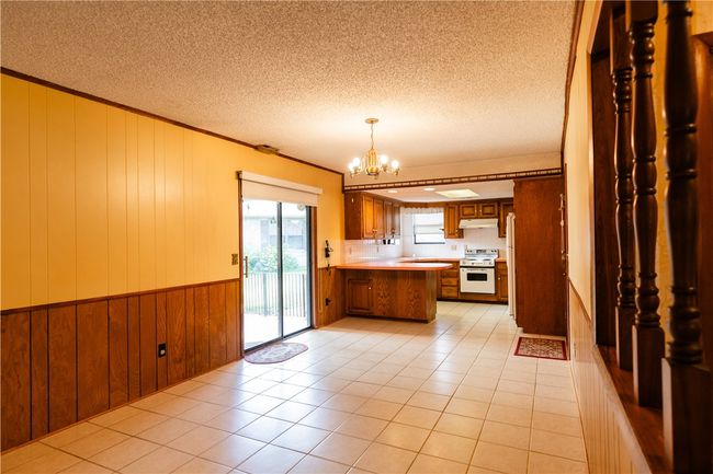 dining area going into the kitchen | Image 19