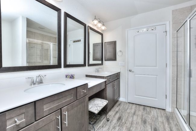 Primary Bathroom has framed mirrors and double vanity. | Image 20