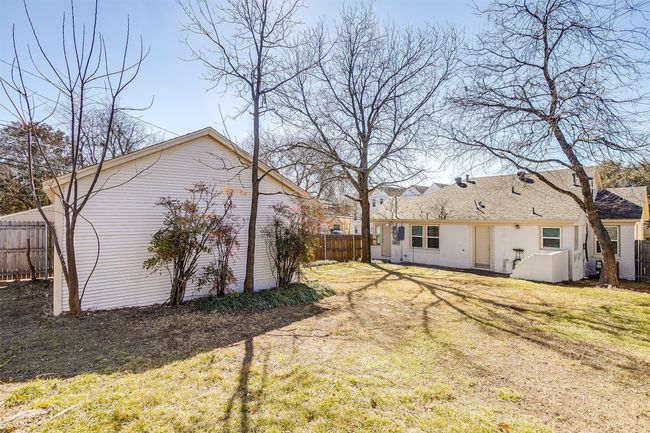 Back of house with roof with shingles | Image 16