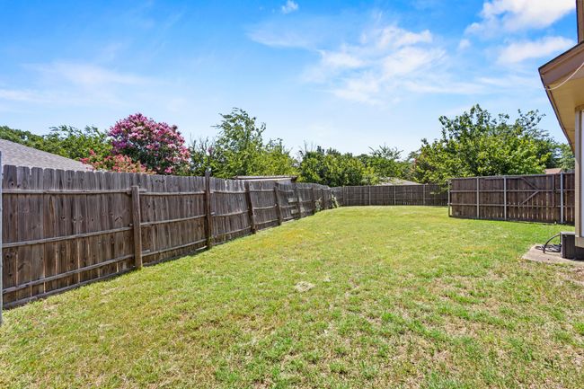 View of fenced backyard | Image 20