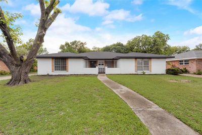 Ranch-style home featuring a front lawn | Image 1