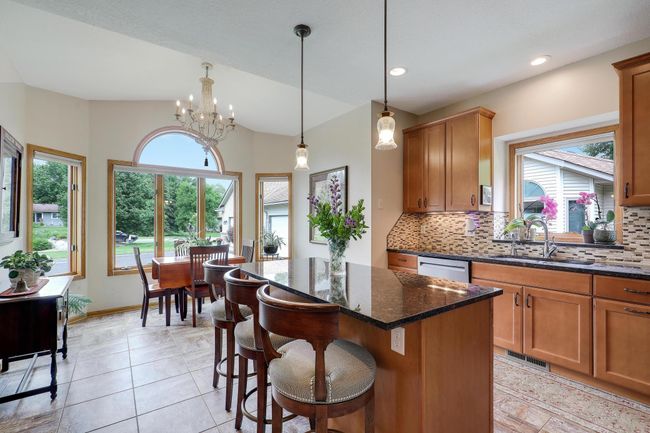 Gorgeous kitchen with island and eat in area. | Image 13