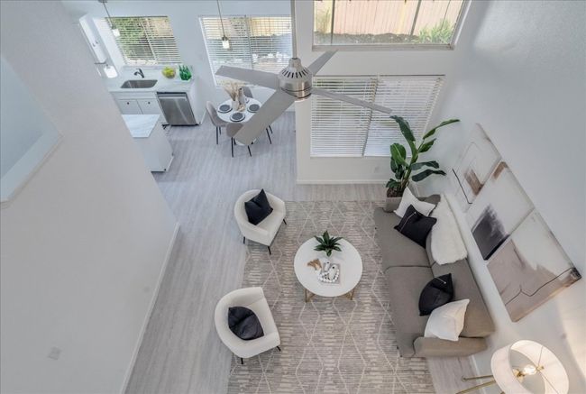 Living area with baseboards and wood finished floors | Image 16