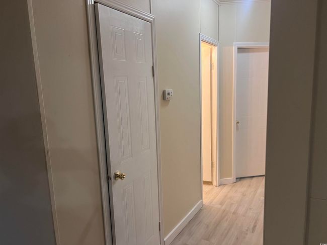 Full bath featuring wood finished floors, vanity, a textured ceiling, toilet, and shower / washtub combination | Image 16