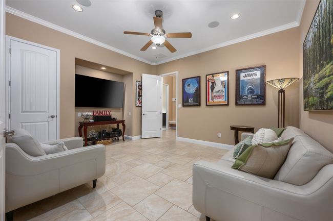Living room featuring a ceiling fan, crown molding, and recessed lighting | Image 24