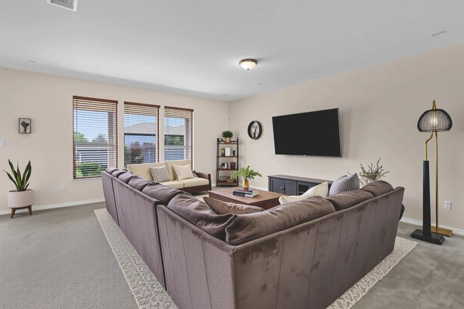 Living room featuring carpet flooring and baseboards | Image 30