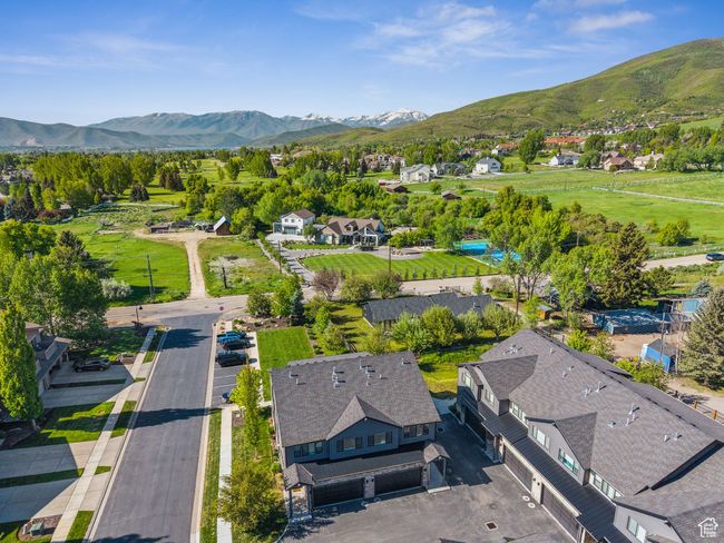 Aerial view of residential area featuring mountains | Image 4