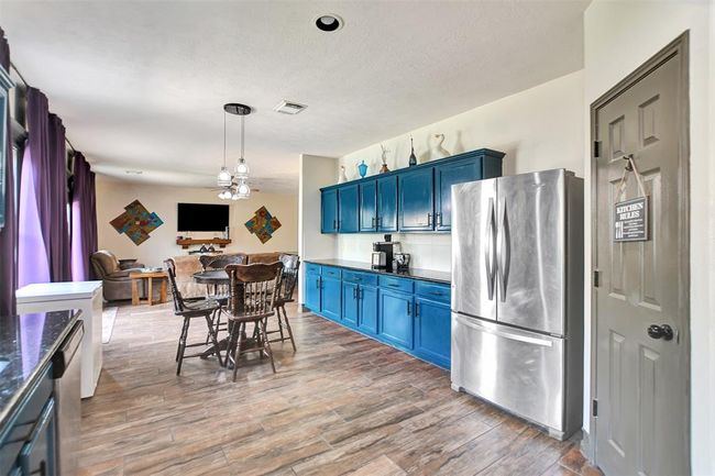 Spacious kitchen with room for a breakfast table or island. | Image 17