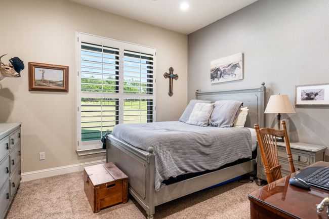 Bedroom with light carpet and baseboards | Image 23