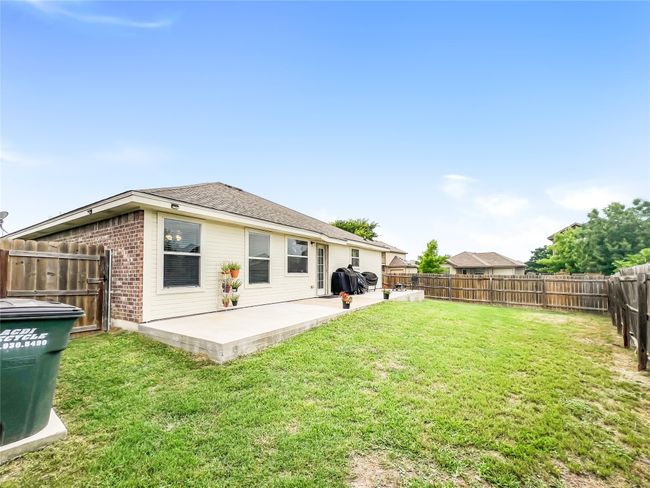 Back of house featuring a patio, brick siding, and roof with shingles | Image 18