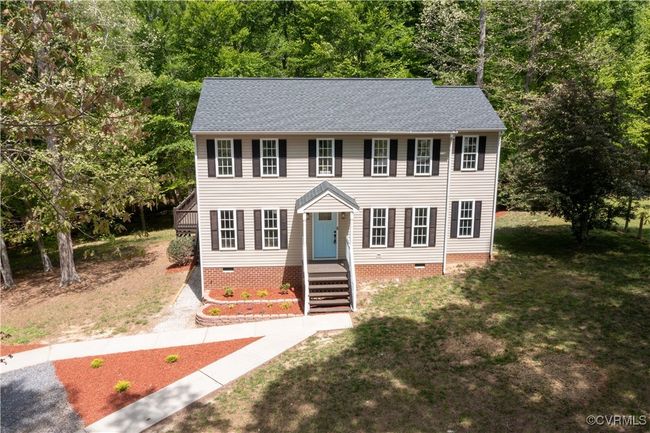 Colonial house featuring crawl space, roof with shingles, and a front yard | Image 39