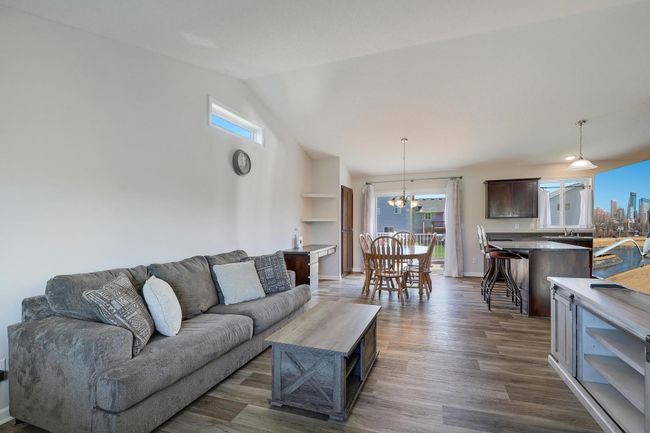 Another view of living room highlights its spacious layout and seamless flow, perfect for relaxing and entertaining. | Image 9