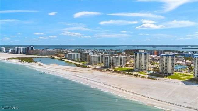 View of urban area with expansive beach | Image 22