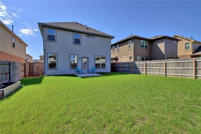 Back of property featuring a fenced backyard | Image 36