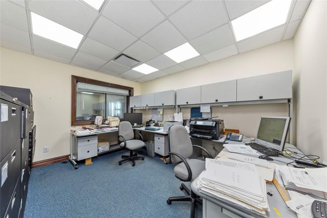 Office with dark carpet and a drop ceiling | Image 14