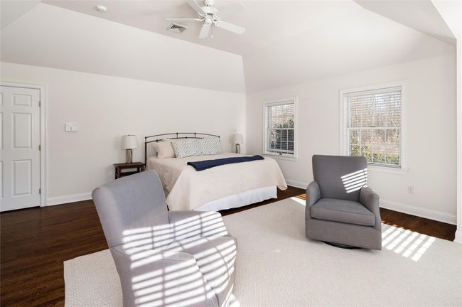 Primary Bedroom featuring ceiling fan, lofted ceiling, dark hardwood flooring | Image 19