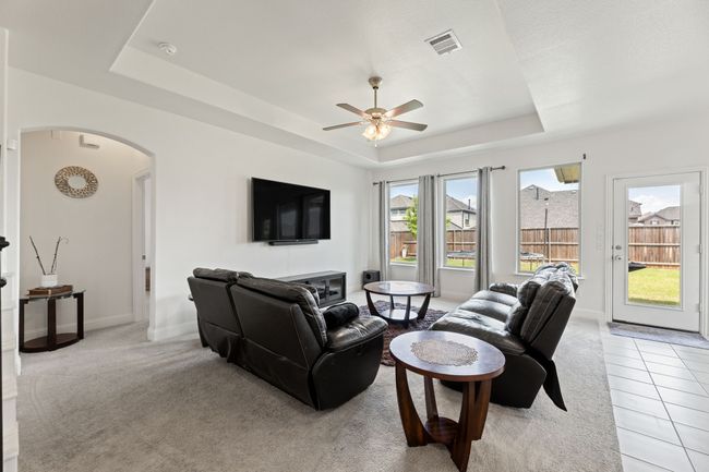 Living room featuring coffered ceiling and wall of windows | Image 10
