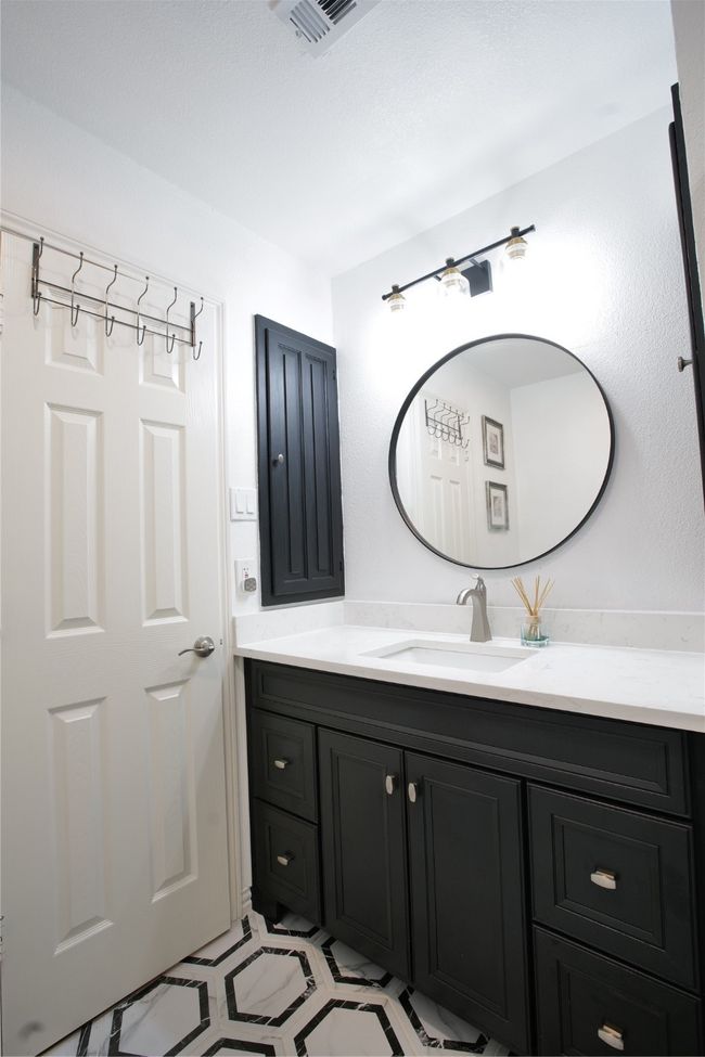 Bathroom with vanity and tile patterned floors | Image 26