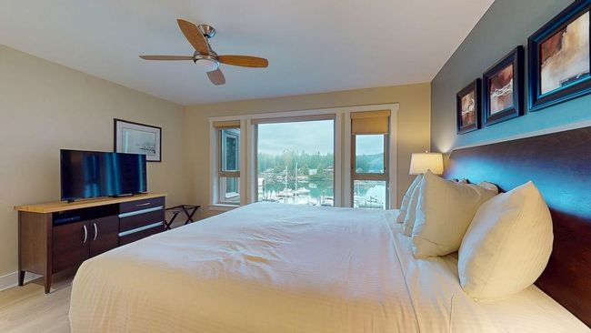 Bedroom featuring baseboards, a ceiling fan, and light wood finished floors | Image 20