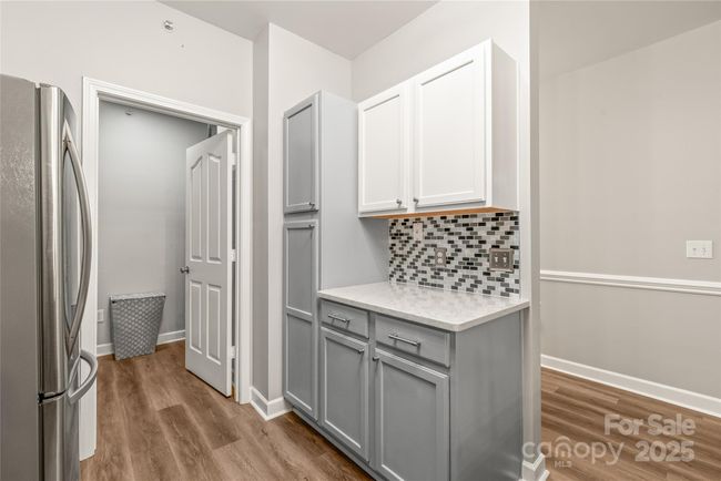 Coffee nook, pantry cabinets, and entrance to the laundry | Image 12