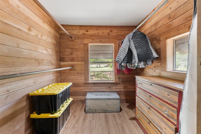 Spacious closet with light wood-style floors | Image 17