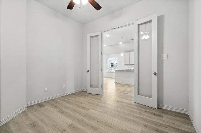 Unfurnished room with ceiling fan and light wood-style floors | Image 28