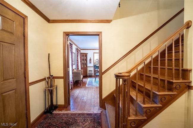 Stairs featuring ornamental molding and hardwood / wood-style floors | Image 17