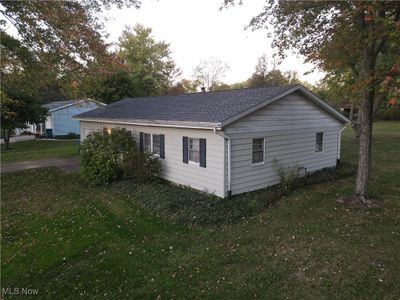 View of side of home with a lawn | Image 3