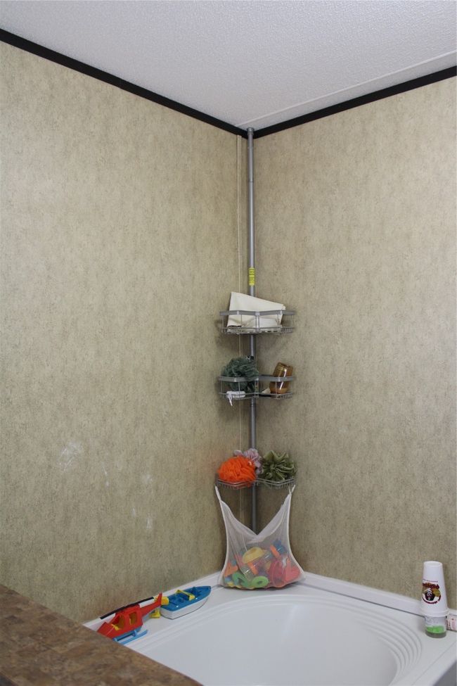 Bathroom view of a bathtub and crown molding | Image 27