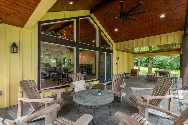 Covered porch with seating and dining area | Image 4