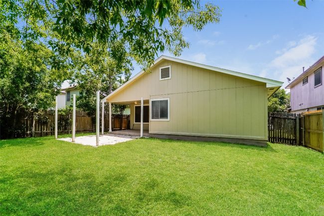 Rear view of house featuring a patio area and a fenced backyard | Image 22