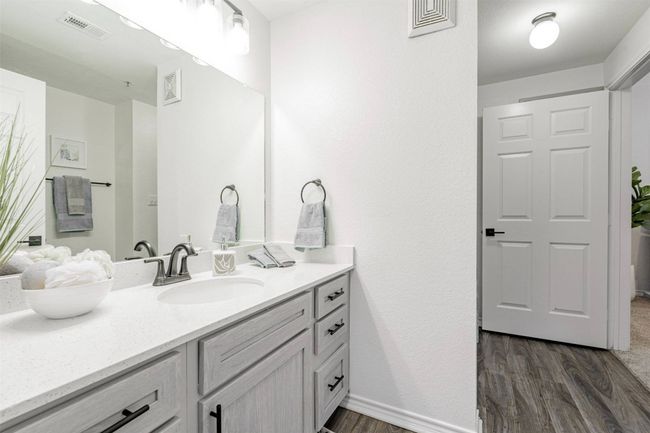Bathroom with hardwood / wood-style floors and vanity | Image 34