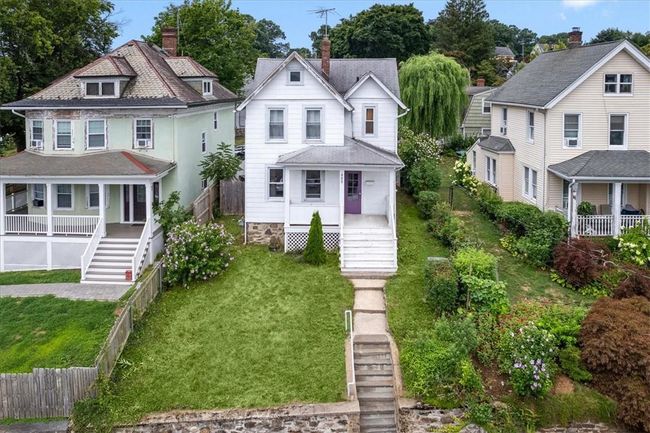 Victorian home featuring a porch and a front yard | Image 20